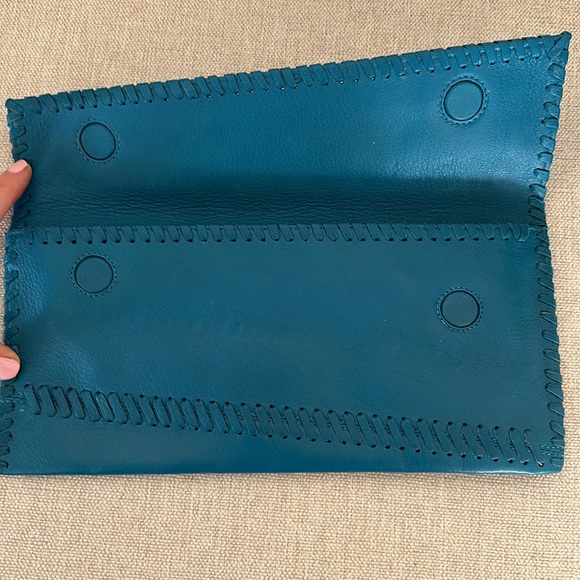 Carlos Falchi leather turquoise clutch. Used only once.